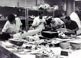 Model makers making repairs on Thunderbird vehicles